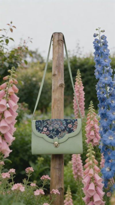 Handcrafted genuine leather and vintage floral sling bag for women in denim blue jacquard with mint green leather trim
