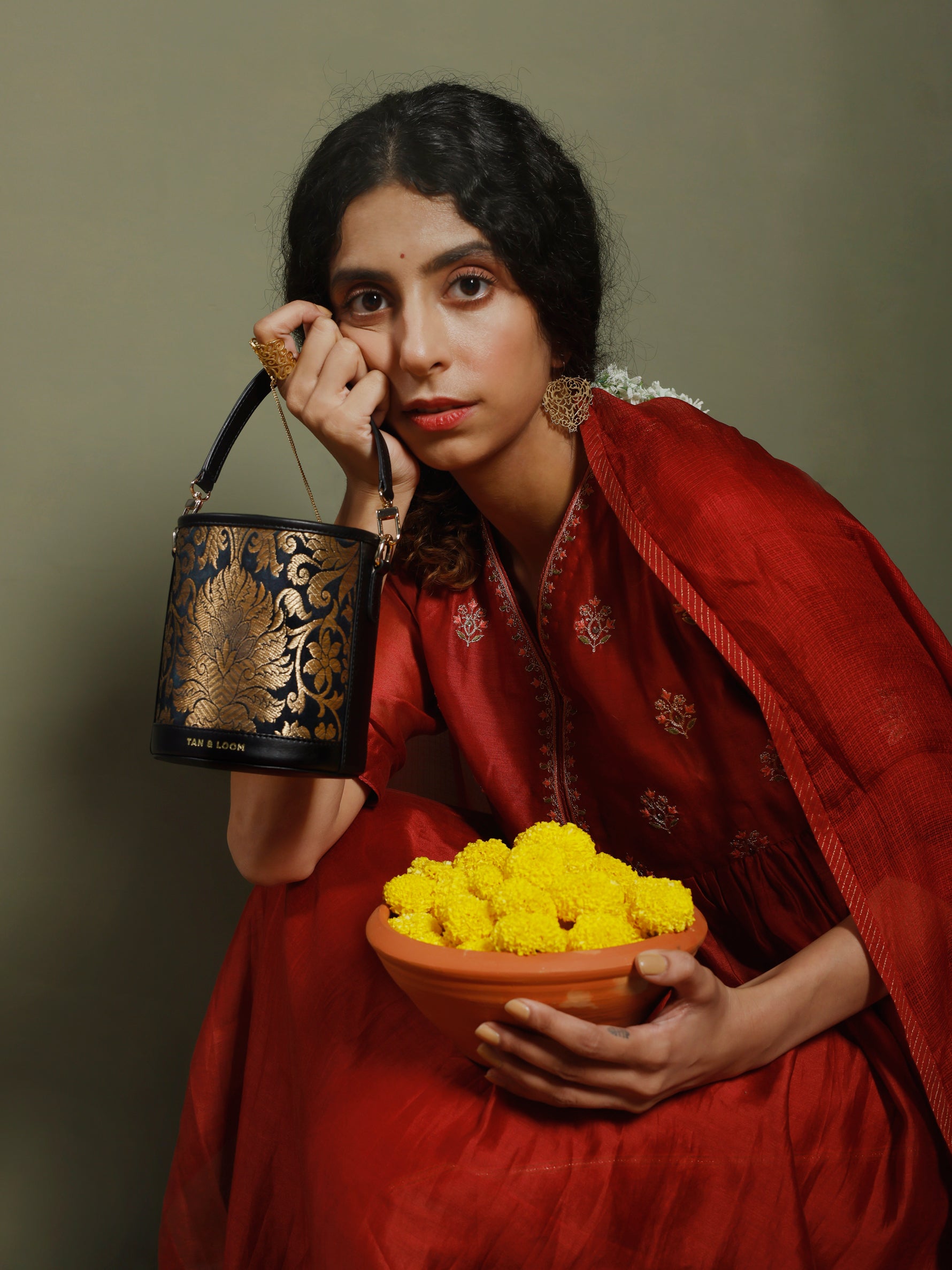 Handcrafted Black Genuine Leather & Banarasi Brocade Cylinder Potli Bag for Women Tan & Loom 